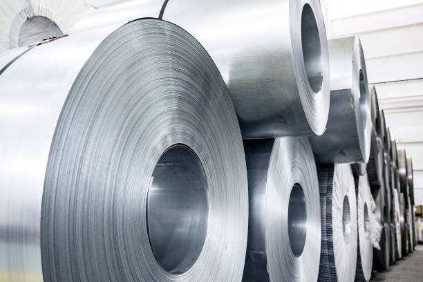 Rolled Coils of Aluminum Large rolls of sheet aluminum in a metal manufacturing facility galvanized stock pictures, royalty-free photos & images