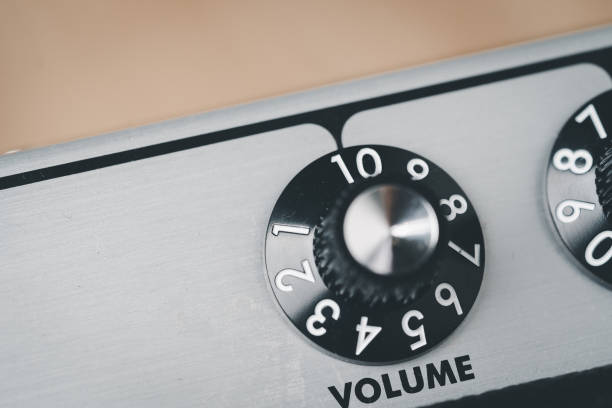 istock Volume control knob of a black amplifier on audio mixing console volume in a stereo 1390300347