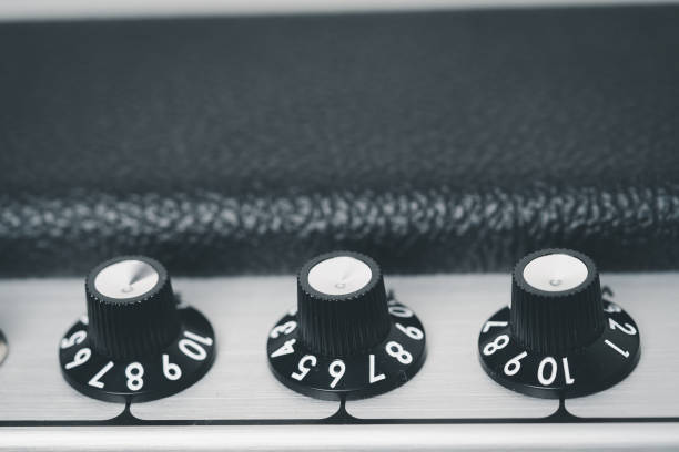 istock Volume control knob of a black amplifier on audio mixing console volume in a stereo 1390300354