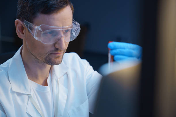 istock Close up of a young scientist in a lab, working with blood samples 1390302947