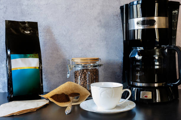istock Coffee machine, a cup, a jar full of Roasted coffee beans 1390302953