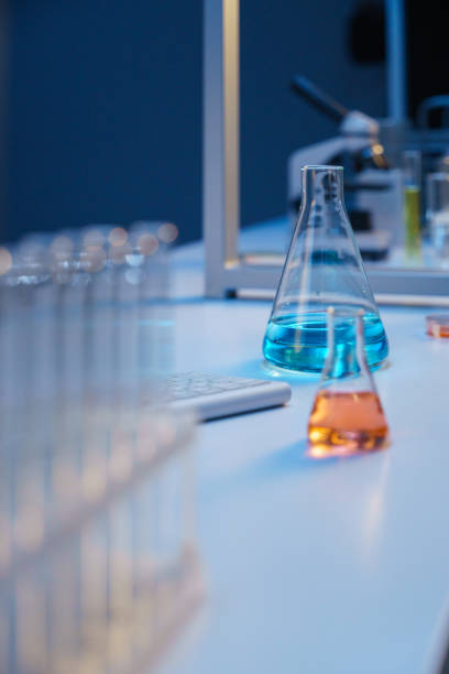 istock Laboratory flasks with colored liquids in a professional illumination 1390303231