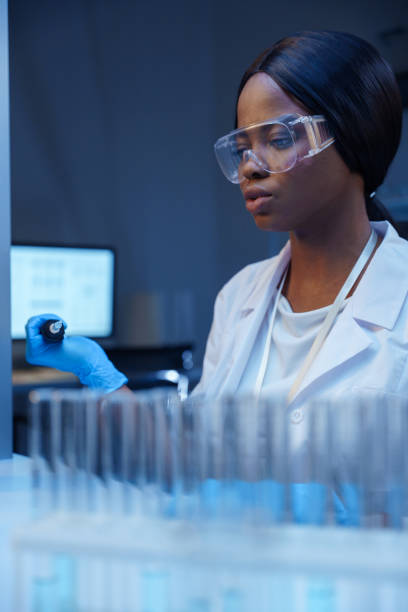 istock A young beautiful African lab doctor in protective glasses working in a modern laboratory 1390303382
