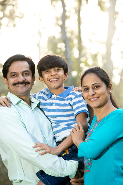 istock Happy family admiring view at park 1390305869