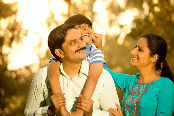 istock Happy family having fun at park 1390306013