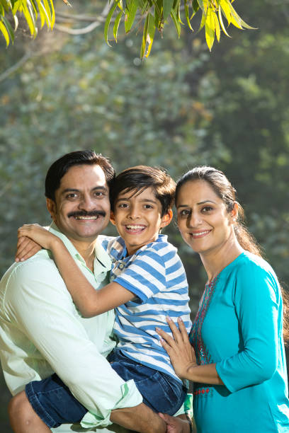 istock Happy family admiring view at park 1390307606