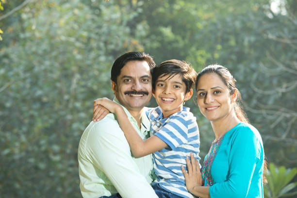 istock Happy family admiring view at park 1390307625
