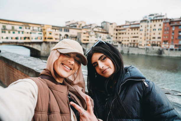 istock Two friends are taking a selfie in Florence, Italy 1390308574