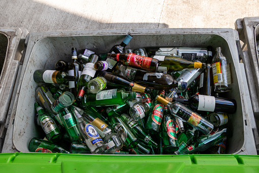 Hong Kong - April 5, 2022 : General view of a tray holding glass and bottles ready for recycling in Wan Chai, Hong Kong.