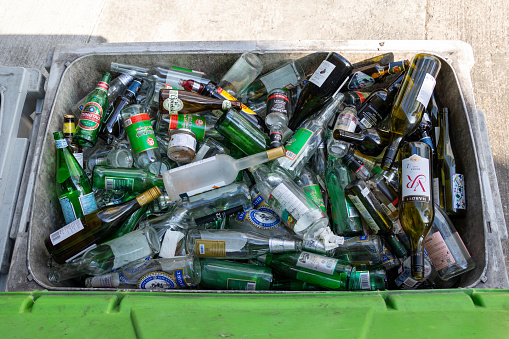 Hong Kong - April 5, 2022 : General view of a tray holding glass and bottles ready for recycling in Wan Chai, Hong Kong.