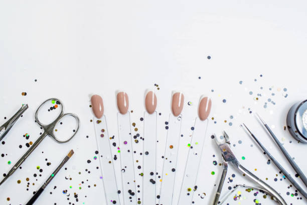 istock Classic French manicure. Nail art design. Nail polish testers and tools. Different forms of manicure. Shiny gel polish. women's nail art.. Copy the space. 1390310036