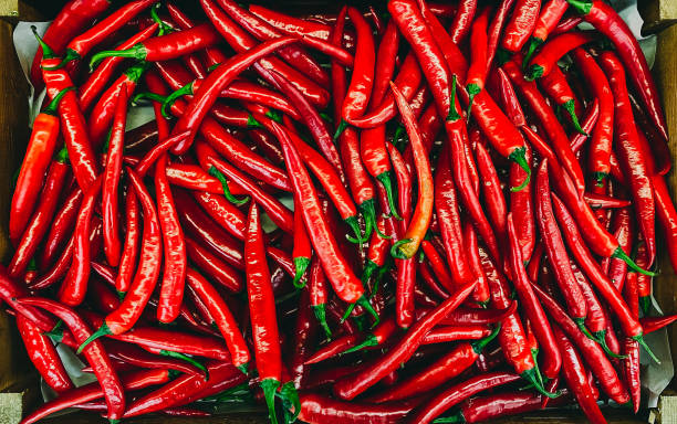 istock Red chili peppers in box 1390310098