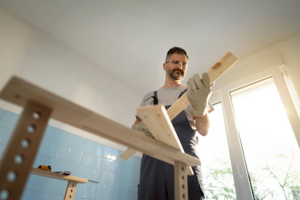 istock Caucasian carpenter, observing the wooden piece/timber 1390310569