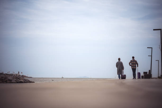 Two Men Traveling with Luggage in Istanbul
