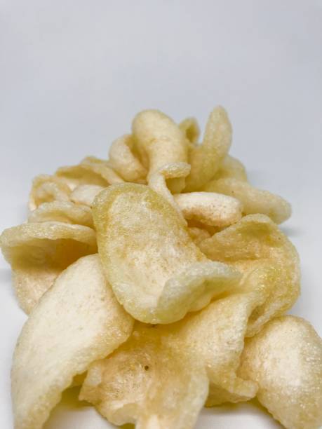 istock Yellow Kerupuk on white background 1390312184