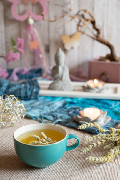 Tea in a turquoise cup with decoration - Greek mountain tea, herbal tea, white tea