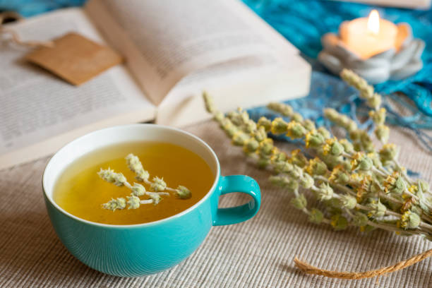 istock Tea in a turquoise cup with decoration - Greek mountain tea, herbal tea, white tea 1390317286