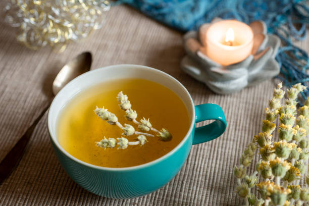 istock Tea in a turquoise cup with decoration - Greek mountain tea, herbal tea, white tea 1390317359