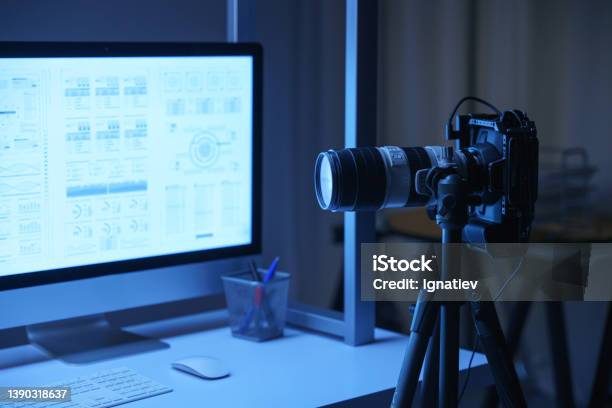 A Professional Camera At A Backstage From Filming A Movie Of A Photo Set In A Laboratory Decorations With A Large Computer Monitor On Desk Stock Photo - Download Image Now