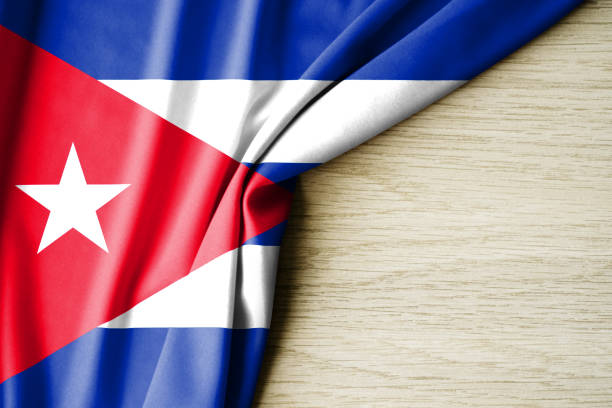istock Cuba flag. Fabric pattern flag of Cuba. 3d illustration. with back space for text. 1390321002