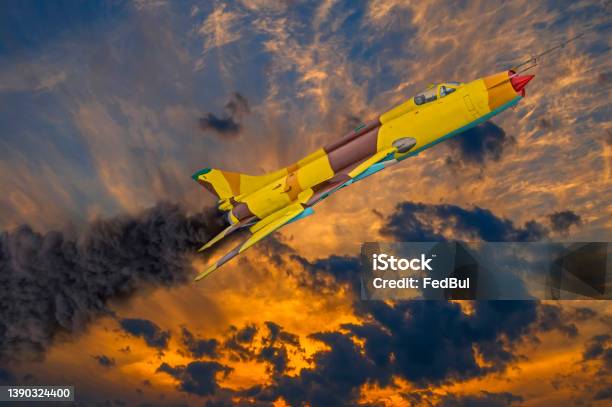 Jet Fighter With Engine On Fire And Smoke Before Crash In Dramatic Sunset Sky Military Strike Aircraft Of World War Time Stock Photo - Download Image Now