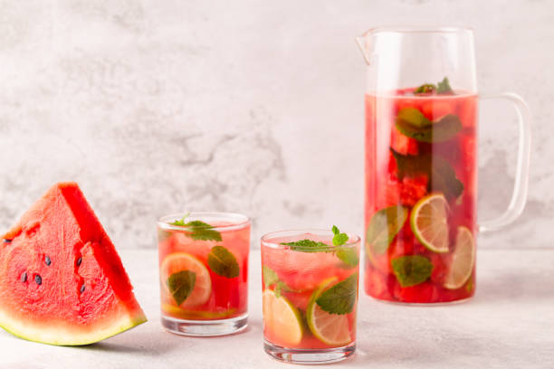 Fresh tasty delicious watermelon lemonade on a light background
