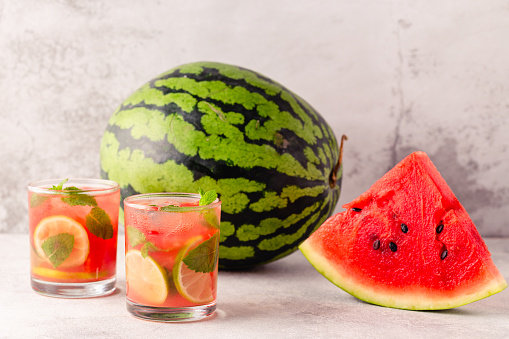Fresh tasty delicious watermelon lemonade on a light background, selective focus