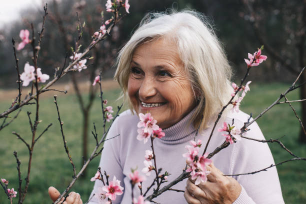 istock Senior woman  outside in spring nature 1390326213