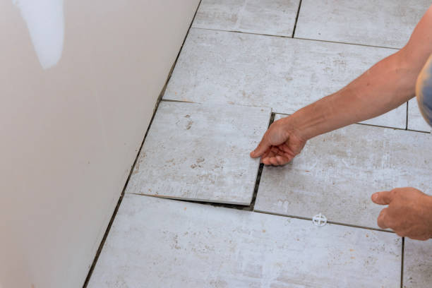 istock Laying floor ceramic tile renovating the house 1390326507