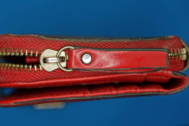 istock gray metal zip on a red leather wallet 1390327307