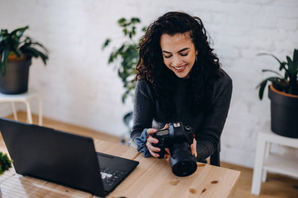 istock Self-employed photographer working with photographs at her desk. 1390329140