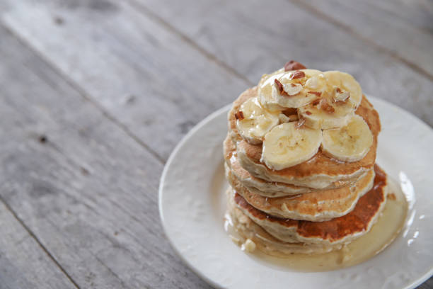 istock Pancakes with bananas, nuts and honey or syrup 1390331198