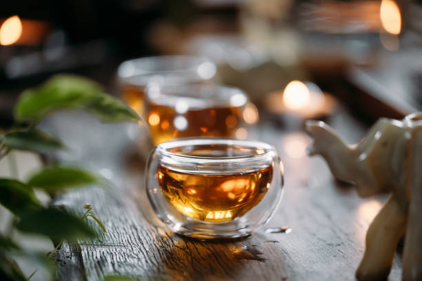 Beautiful chinese tea in teacup with candle flame decoration