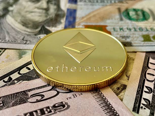 Ethereum Coin - Ether Investment Ethereum on U.S Currency Background. Digital currency used for verified transactions while  maintaining a digital record in  a decentralized system using cryptography, rather than by a centralized authority. ethereum stock pictures, royalty-free photos & images