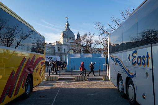 Lviv, Ukraine - March 11, 2022: Evacuation buses are parked outside the Lviv train station in Ukraine.