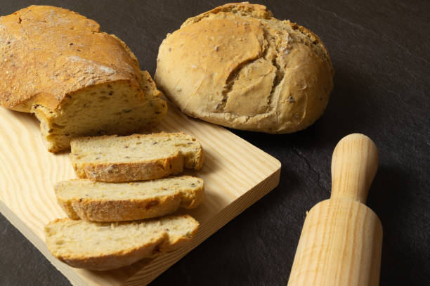 istock sourdough bread slices on wooden board 1390333701