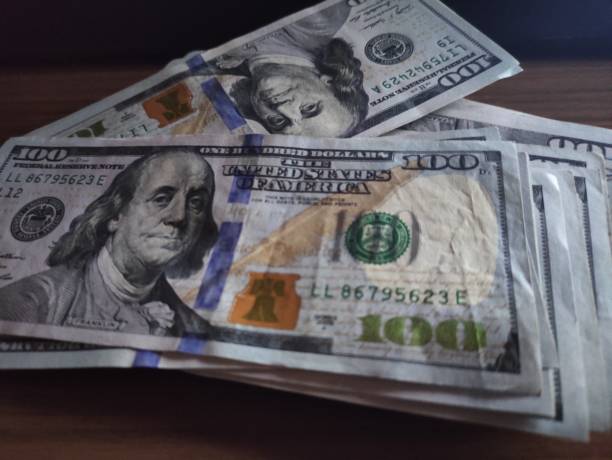 istock 100 Dollar Bills, USD 100, One Hundred American Dollar bills 1390333848