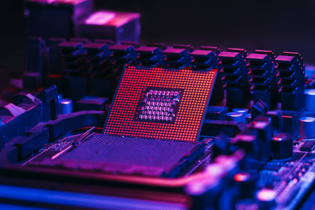 istock The processor on the motherboard in neon light. Computer parts. Close-up photo