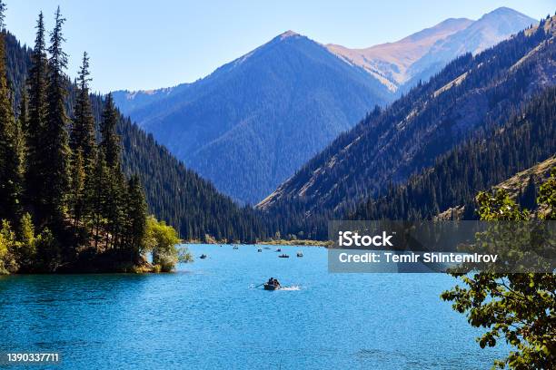 View Of A Mountain Lake Surrounded By Forest Stock Photo - Download Image Now - Kazakhstan, Tourism, Almaty