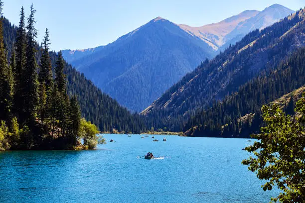 view of a mountain lake surrounded by forest. Kolsay Lakes National Park, Kazakhstan