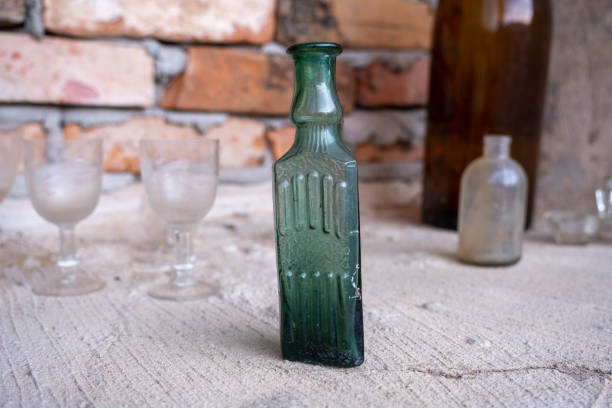 istock Various retro empty glasses and bottles on the window sill 1390340591