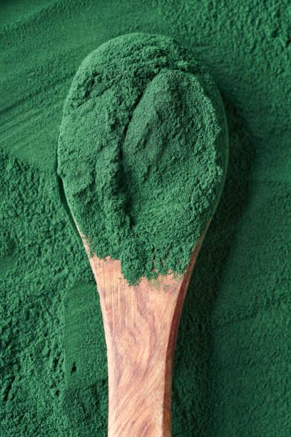 istock Spirulina powder on a spoon - healthy nutritional supplement 1390340824