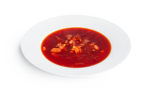 istock Red, hot borscht - beet soup isolated on a white background 1390342106