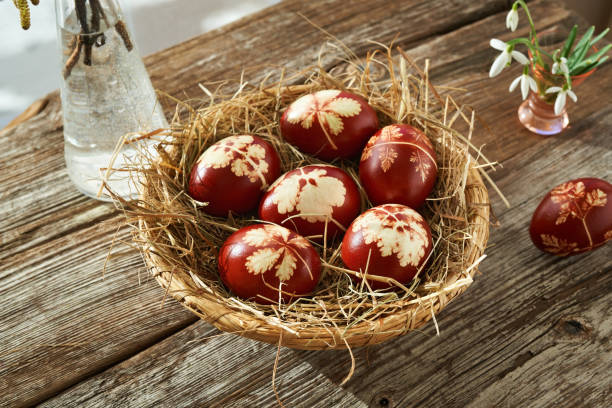 istock Homemade Easter eggs in a basket with snowdrops in spring 1390342275