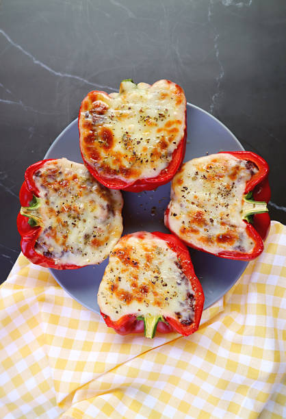 istock Top View of Fresh Cooked Delectable Stuffed Bell Peppers on Kitchen Table 1390343220