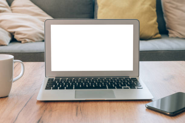 istock Laptop computer blank empty mock up screen in home office interior, working from home concept 1390343596