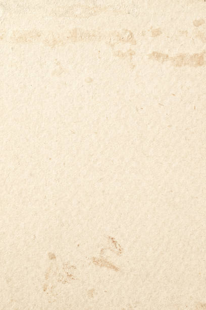 istock Paper background. old paper canvas faded over time 1390349214