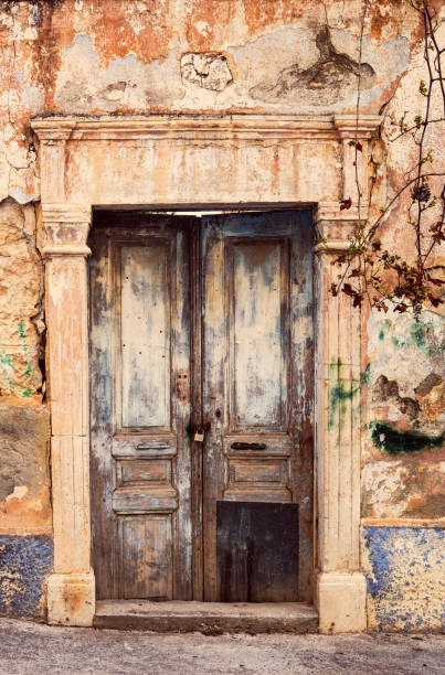 istock The background old beige wall with retro door 1390350950