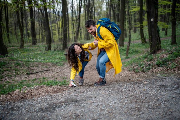 istock Happy couple climbing the hill together 1390351343