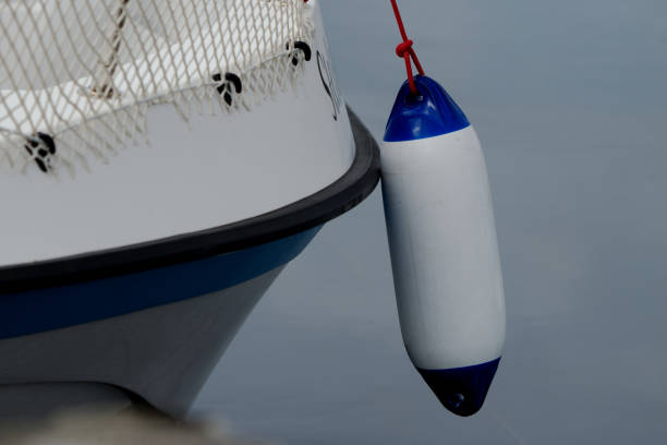 Fenders protecting two boats from each other at quay